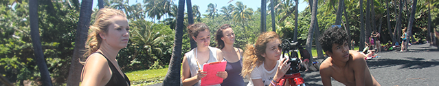 Campers collect data at a black sand beach